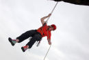 06-8127 Rock Climber Abseiling into Free Space Below an Overhang, Teesdale County Durham